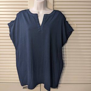 Short blue top with stylish shoulders